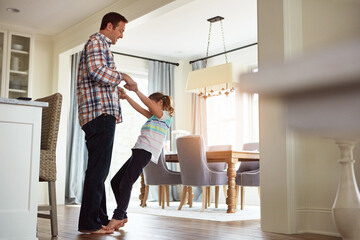 Dad, girl or dancing in home on feet together, growth or development with role model. Father, happy...