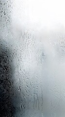 Obraz premium Transparent blurred foggy glass with steam and condensation on surface. Vertical.