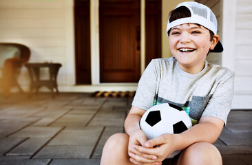 Children, laugh and funny boy on a porch with soccer ball for summer camp, learning and sports. Face, smile and kid with football outdoor for bootcamp, training or weekend games, development or home
