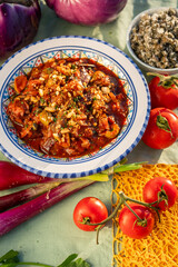 caponata is a Sicilian dish consisting of chopped fried eggplant aubergine and other vegetables, seasoned with olive oil, tomato sauce