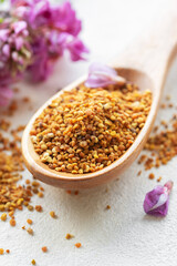 Healthy bee pollen grains.  Bee pollen on a wooden spoon