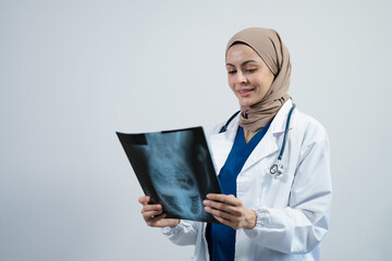 professional medical specialist in a white coat holding x-ray film analyzed, isolated on white background.