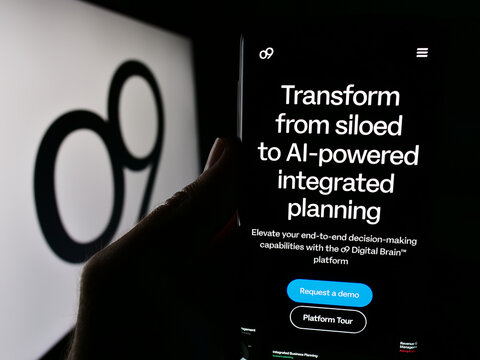 Stuttgart, Germany - 06-01-2024: Person holding cellphone with website of US analytics software company o9 Solutions Inc. in front of logo. Focus on center of phone display.