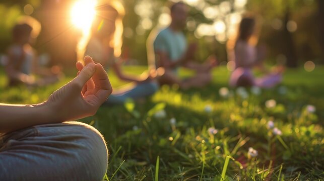 The image shows a group of diverse people doing yoga in a park
