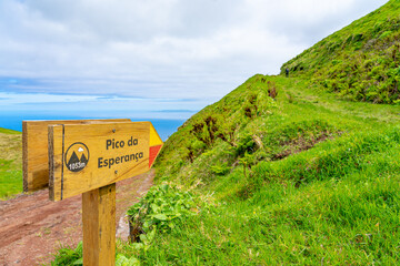 wooden arrow sign indicating direction along the trail to Pico da Esperança. São Jorge...