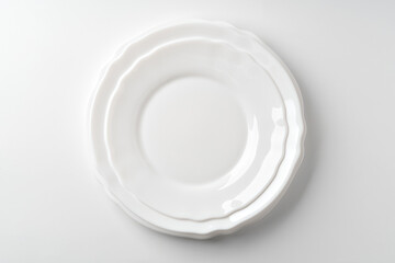 Set of white dinner plates on white background