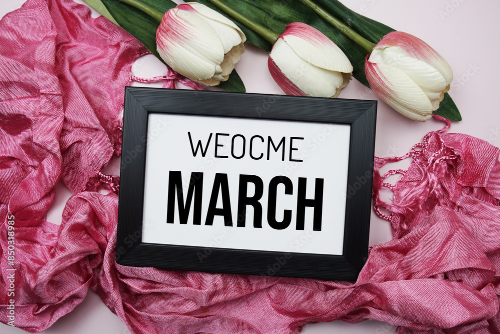 Sticker Welcome March text message with pink tulip flower on pink background