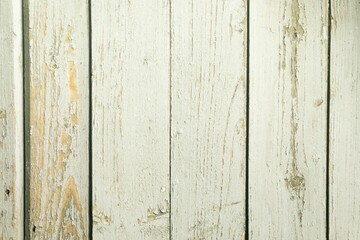 Naklejka premium A closeup of a wooden floor with planks. The wood looks aged and weathered and has various shades of brown and natural grains. The surface has a slightly rough texture with visible lines and spots.