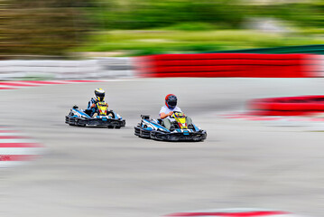 Young racers competing with karts on a Karting circuit in Barcelona. Lifestyle