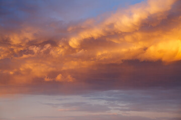Incredible colorful sunset with cloudy sky lit by the sun.