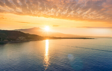 picturesque view to a sunset sea gulf with beautiful mountains and amazing cloudy sky on background of nice travel landscape