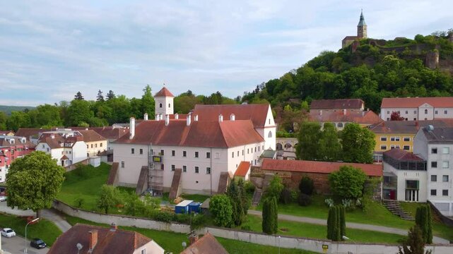 Built Structures With View Of G&uuml;ssing Castle In Distance In Burgenland, Austria. drone shot