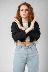 Young Woman Standing With Her Arms Crossed