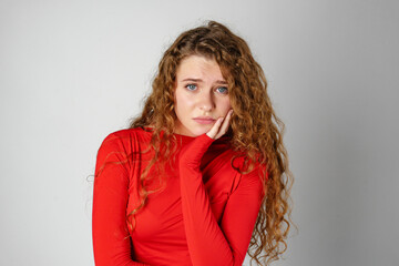 Young Woman With Curly Hair Expressing Concern