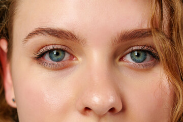Naklejka premium Close Up of Woman With Blue Eyes