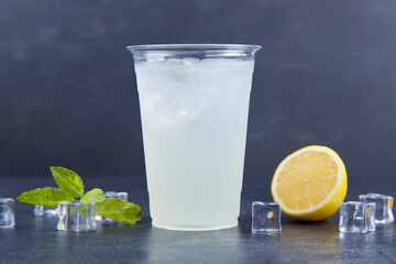 Turkish Lemonade with a Mint Garnish: Lemonade with a mint garnish on a wooden table
