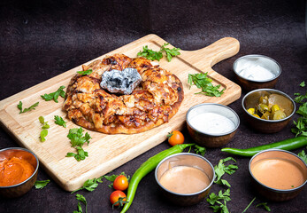 Turkish Iskender Shawarma Meat or beef or chicken with Charcoal in the center and sauces around. Cook fries grilled meat shawarma. Hot fresh delicious kebabs - a fine selection of street food.