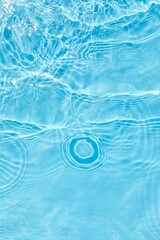 Abstract water, cosmetic background with rings, water surface. Background with spa concept, waves in the pool