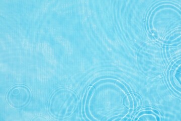 Abstract water, cosmetic background with rings, water surface. Background with the concept of a spa, splashing in the pool