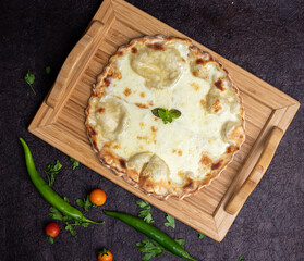 Manakeesh, Turkish arabic pizza, flat bread topped with Akkawi cheese, Labna and zaater for breakfast. Homemade mediterranean flat bread manakish. Arabic cuisine.