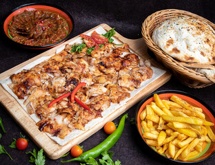 Chicken Shawarma plate with salad, fries served in a dish isolated on grey background side view of arabian fastfood