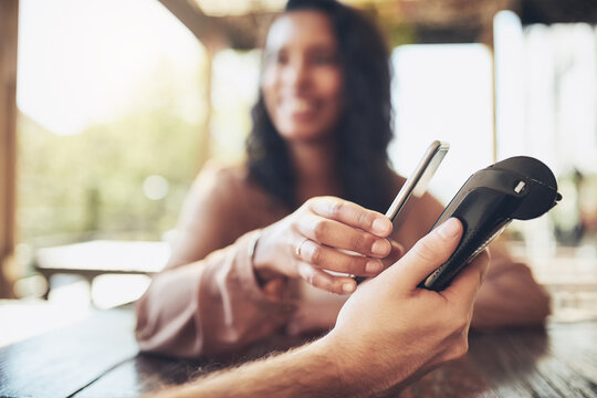 Woman, smartphone and nfc terminal in coffee shop for payment by customer for waitress service. Finance, bill and pos with person paying paperless using wireless technology in cafe or restaurant