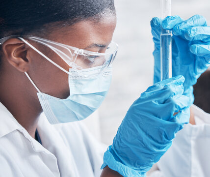 Black woman, science and research in lab with test tube for medical innovation and ppe safety for chemistry experiment. African lady, scientist and pharmaceutical study with liquid sample for vaccine