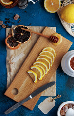 Warm lemon tea with honey. Blue concrete background. High quality photo