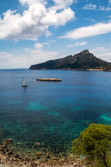 Sailboat on the coast of Sa Dragonera Island, Sa Dragonera Natural Park, Sant Elm, in Andratx, Majorca, Balearic Islands, Spain