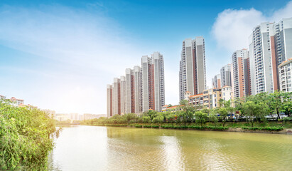 Fototapeta premium A high-rise apartment by the river in Zhanjiang, China.