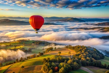 Red hot-air balloon flying over the hills and mountains above the clouds, awesome landscape view, Melbourne, Australia, Yarra Valley