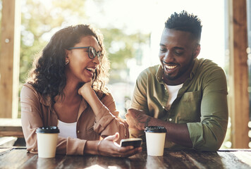 Laugh, man and woman in cafe with phone, smile and connection for online dating relationship. Social media, love and couple in coffee shop with mobile app for contact, romance and joking together
