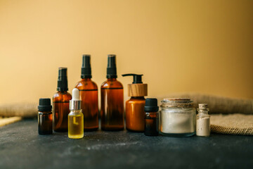 Cosmetics packaging. Set of different cosmetic bottles of cream or serum on a ceramic tray. Blank packaging. Natural beauty spa product concept. Beauty