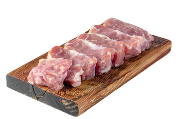 Fototapeta premium Sliced raw pork neck on a wooden board with a white background