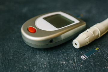 Instruments for measuring blood sugar top view on black background