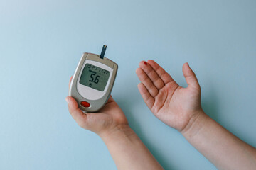 Child measuring blood sugar level