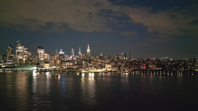 New York City Skyline at dusk night aerial view. NYC near night from drone. New York City skyline, cityscape of Manhattan in USA. Panoramic aerial view on Manhattan at night. Travel in USA.