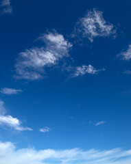 White fluffy clouds in the blue sky.