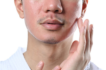 Man applying cream on face isolated on white background. Skin care and cosmetic procedures concept