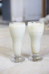 Chaas Masala Lassi with mint served in glass isolated on table top view of punjabi culture