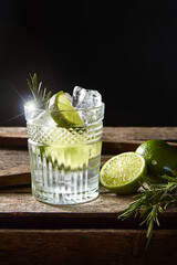 Classic Mojito Cocktail Against Black Background On A Brown Wooden Table. 