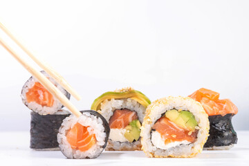 Creative  Japanese seafood sushi set background containing sushi rolls, maki, gunkans with...