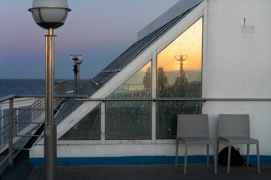 Sunset reflected in the windows of the boat deck