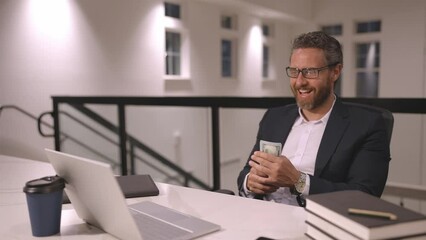 Speed up earn money. Accelerated video of business man counting dollars in office. Office worker in suit with dollars. hHyperspace of office employer hold dollars money banknotes.