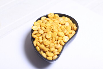 Fried and Spicy Chana Dal Masala namkeen is a popular Chakna recipe. served in a bowl