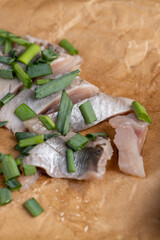 salted herring fillet on the table