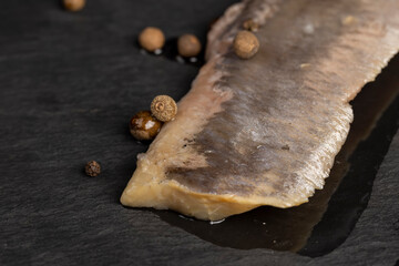 salted herring fillet on the table