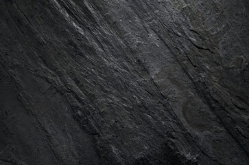 Dark stone texture background close up