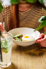 woman eating in the asian cafe