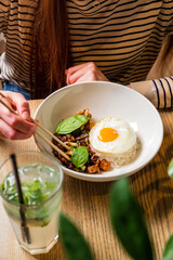 woman eating in the asian cafe